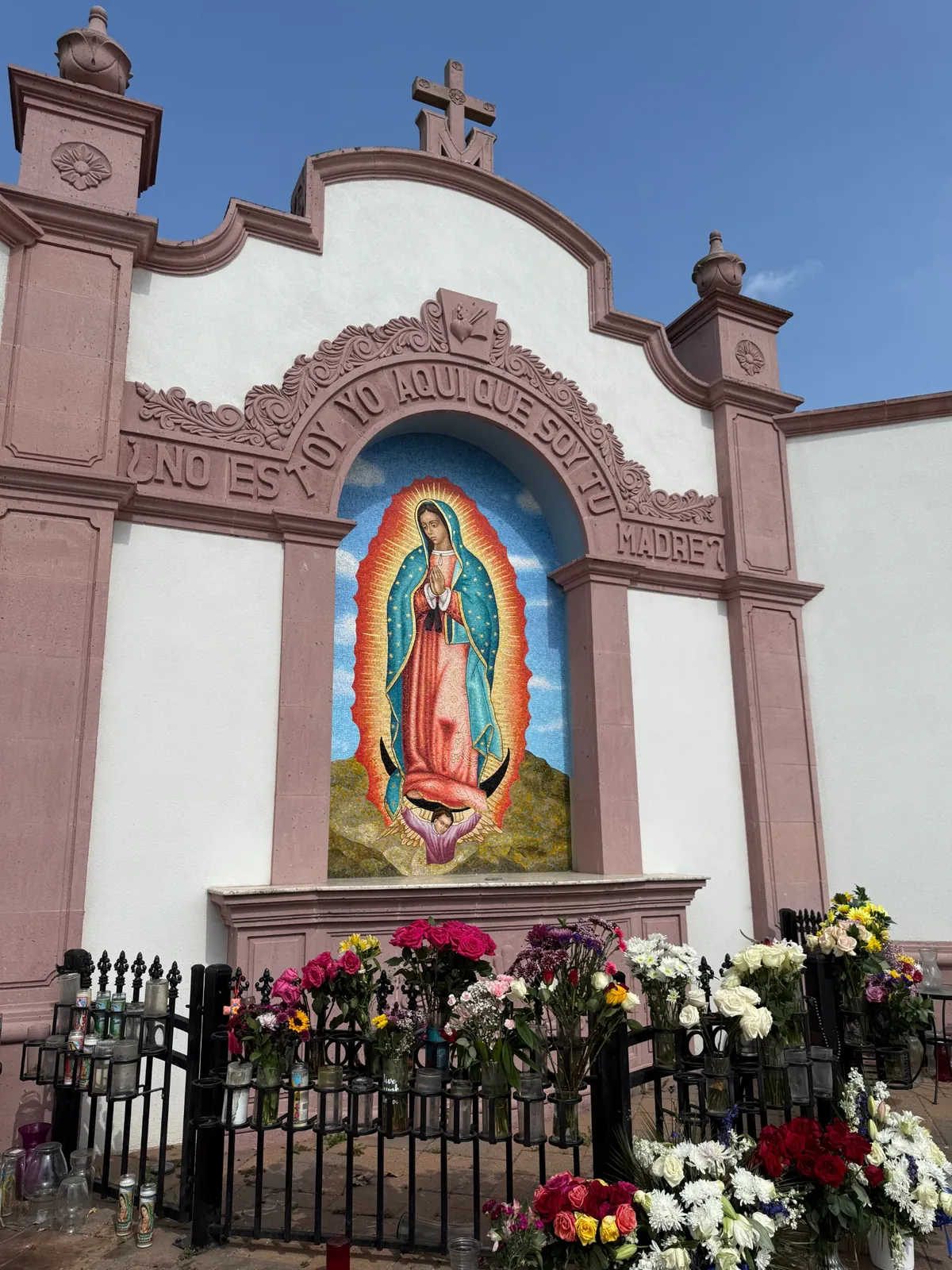 Our Lady of Guadalupe mural in Houston with flowers